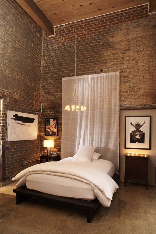 Bedroom with Double-Height Brick Walls